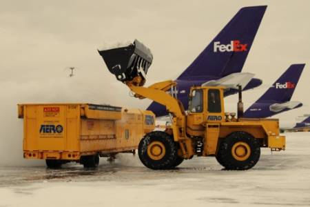 Dumping Snow into a Snow Melter at an Airport